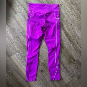 Fabletics small purple leggings with reflective side stripe